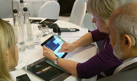 An image of a delegate using an iPad